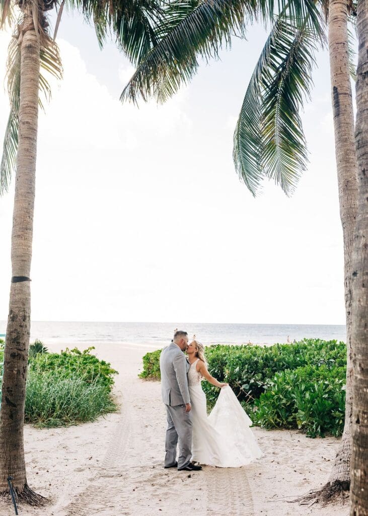 Wedding portraits under palm trees in the bahamas